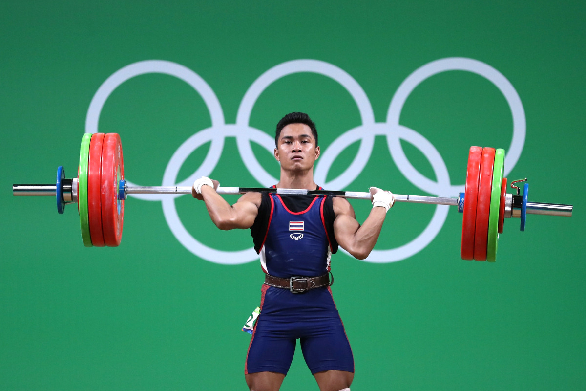 спортсмен штангист. атлет штангист. наталья заболотная тяжелая атлетика. штангист со штангой. моника ченгери тяжелая атлетика.