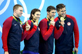 Золото американцев в мужской и женской эстафетах 4x100